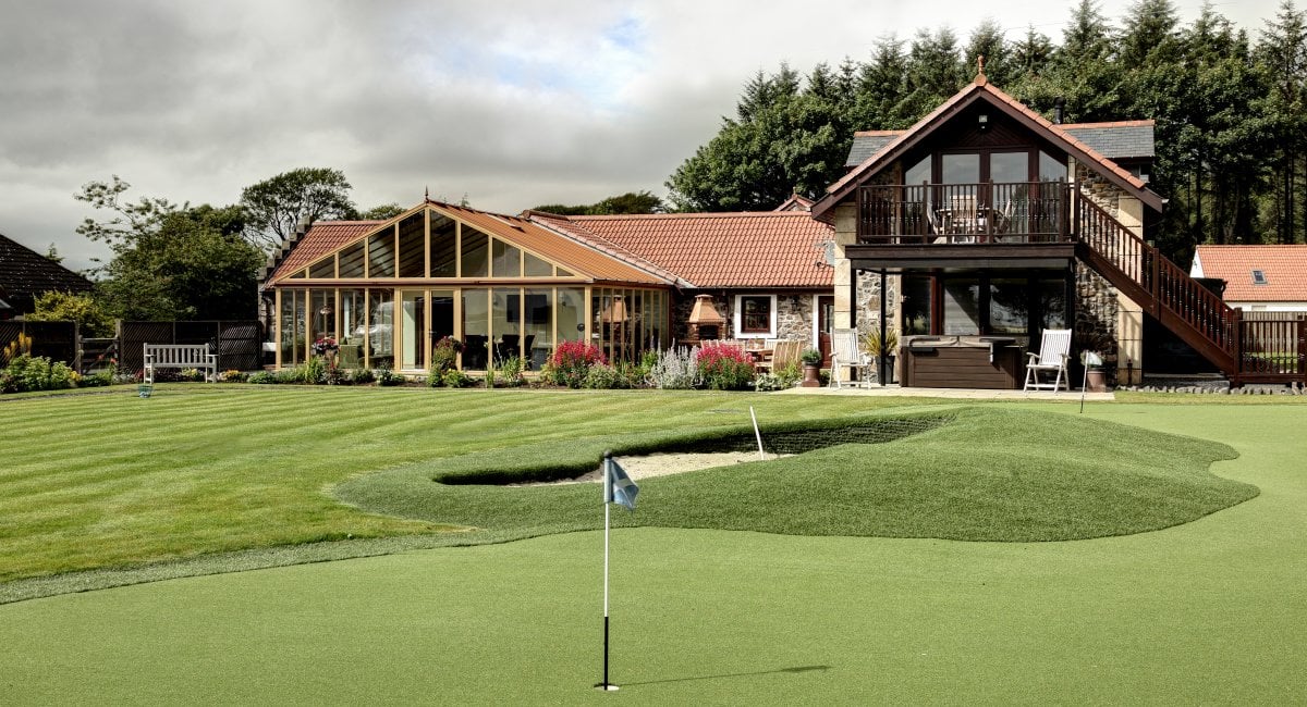 Hawkswood House - short game practice with holes and bunker